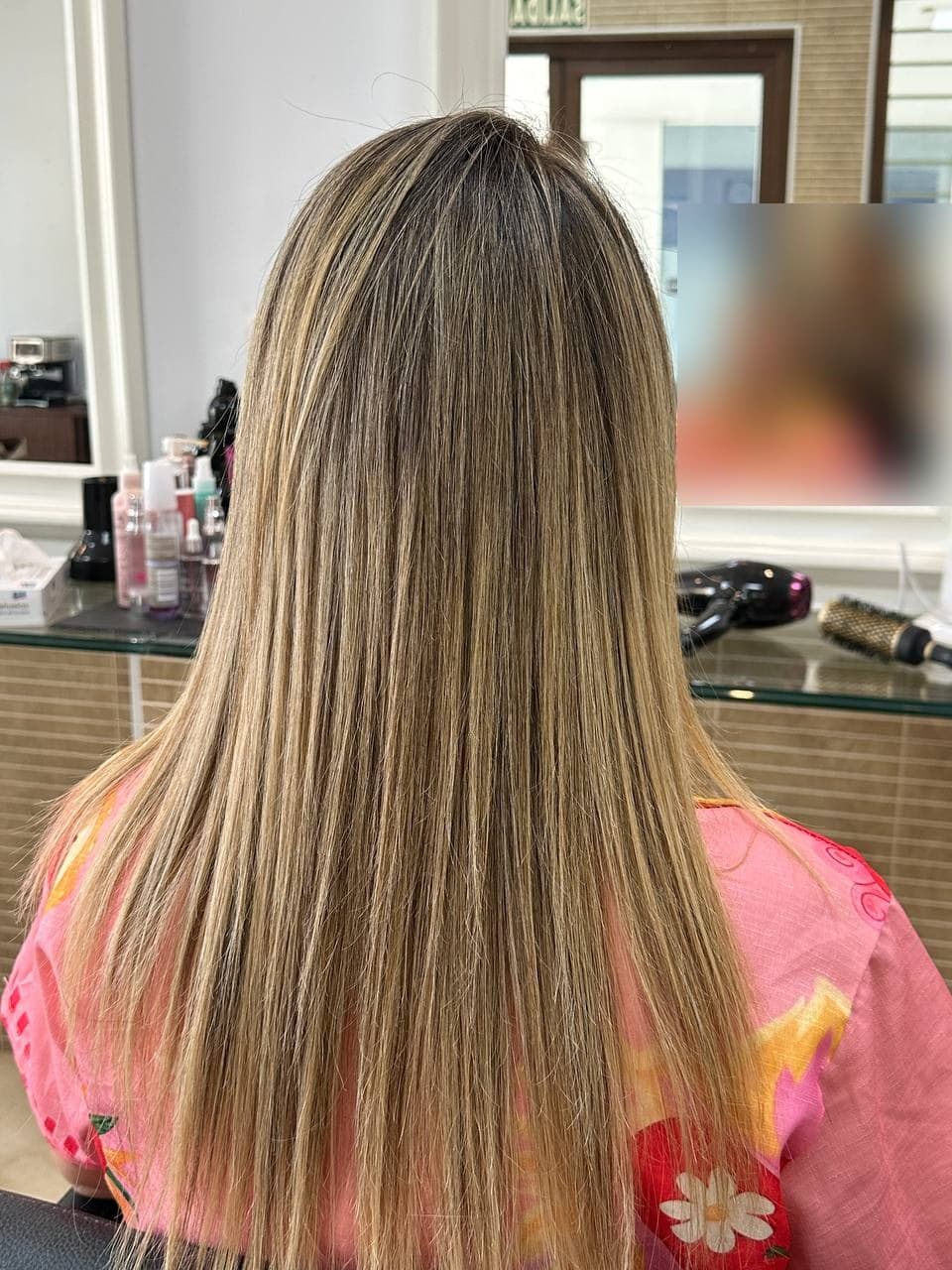 Smooth, glossy hair after a smoothing treatment at The Lounge Marbella